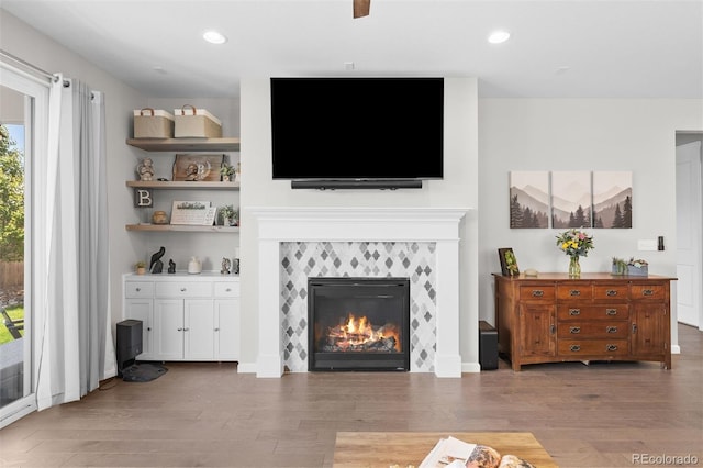 3575 White Rose Loop, Castle Rock, CO 80108 - living room featuring wood finished floors, a tile fireplace, and recessed lighting