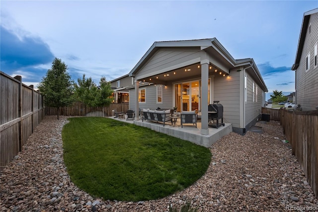 3575 White Rose Loop, Castle Rock, CO 80108 - rear view of property featuring a fenced backyard, a patio, and outdoor lounge area