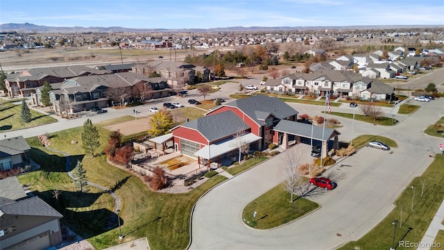 birds eye view of property with a mountain view