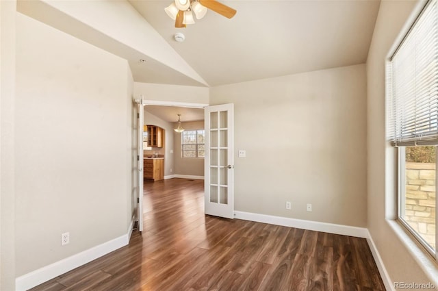 spare room with french doors, dark hardwood / wood-style floors, ceiling fan, and lofted ceiling