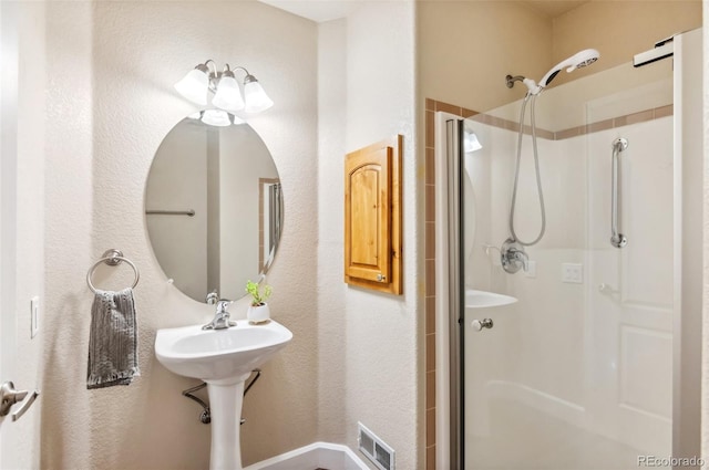 bathroom featuring an enclosed shower