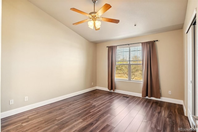 spare room with ceiling fan and dark hardwood / wood-style flooring