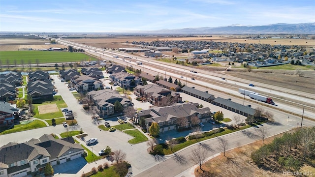 birds eye view of property with a mountain view