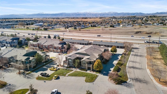 birds eye view of property featuring a mountain view