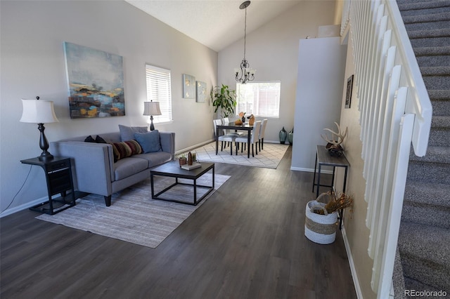 5630 W 115th Ave, Westminster, CO 80020 - living area featuring stairway, wood finished floors, vaulted ceiling, and a chandelier