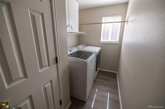 5630 W 115th Ave, Westminster, CO 80020 - laundry room featuring cabinet space, washing machine and clothes dryer, and dark wood-style flooring