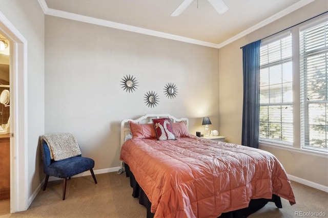 carpeted bedroom featuring ceiling fan and crown molding