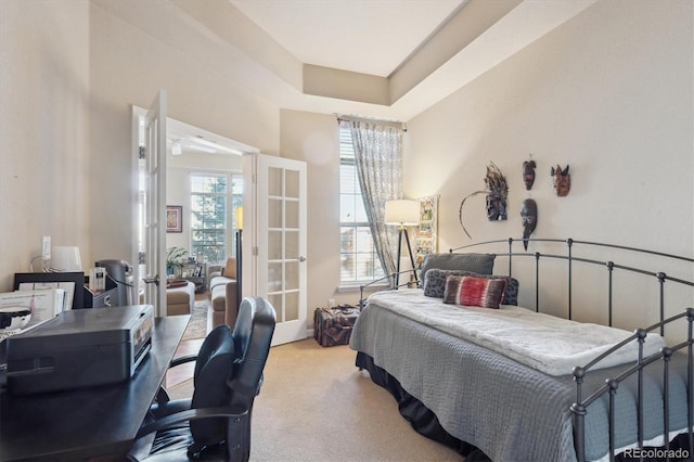 carpeted bedroom with french doors