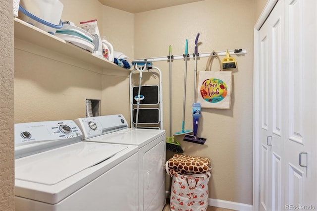 7865 Vallagio Ln Unit 207, Englewood, CO 80112 - washroom with washing machine and dryer and baseboards