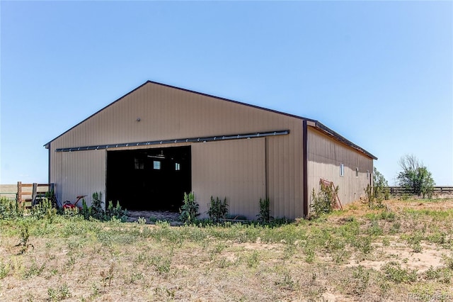 view of home's exterior with an outdoor structure