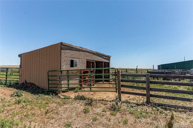 view of outdoor structure with a rural view