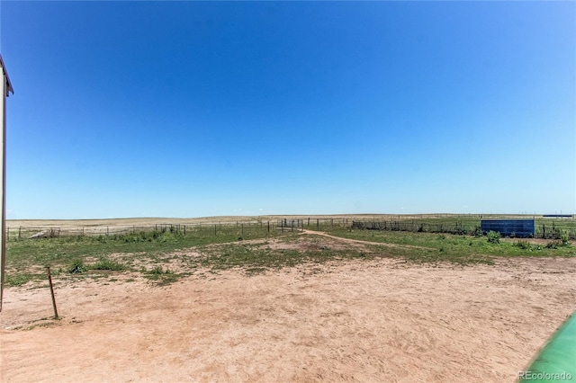 view of yard with a rural view