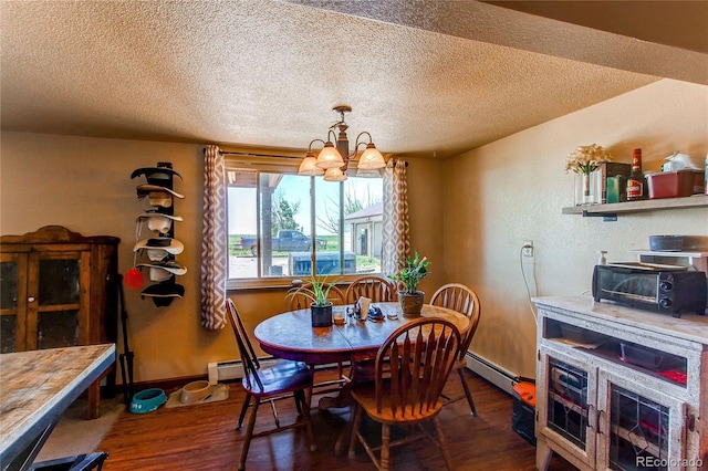 dining space with a notable chandelier, dark hardwood / wood-style floors, a textured ceiling, and a baseboard radiator