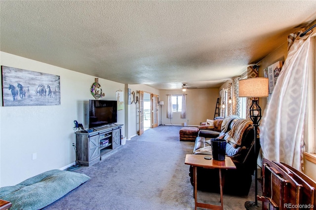 living room with carpet floors and a textured ceiling