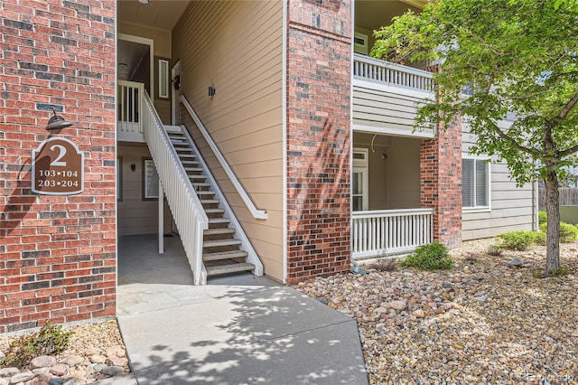 entrance to property with brick siding