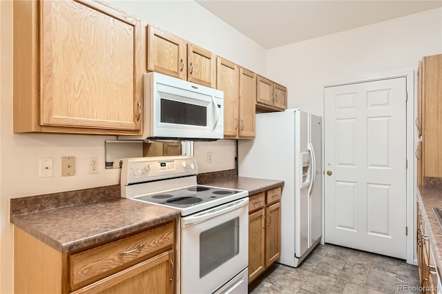 kitchen featuring white appliances, dark countertops, and light brown cabinets