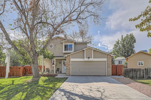 6311 Xavier St, Arvada, CO 80003 - traditional-style house with brick siding, driveway, and an attached garage
