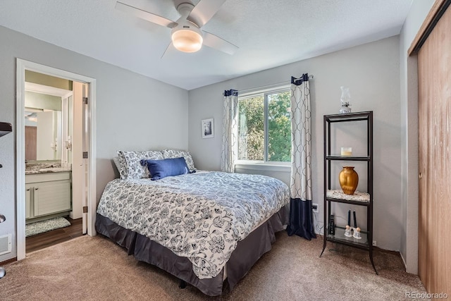 6311 Xavier St, Arvada, CO 80003 - carpeted bedroom with ensuite bathroom, ceiling fan, and a closet