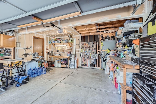 6311 Xavier St, Arvada, CO 80003 - garage with a workshop area and a garage door opener