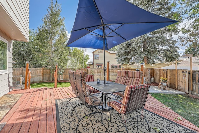 6311 Xavier St, Arvada, CO 80003 - deck featuring outdoor dining area and a fenced backyard