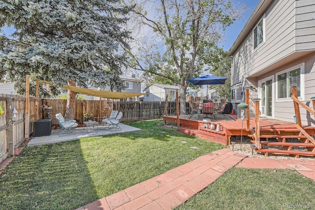 6311 Xavier St, Arvada, CO 80003 - view of yard featuring a deck and a patio area