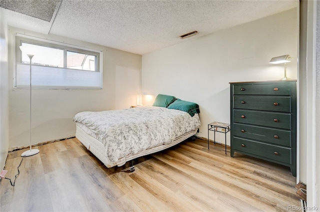 bedroom with light hardwood / wood-style flooring