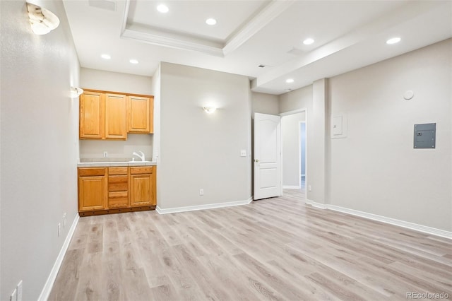 17309 Witten Ct, Parker, CO 80134 - interior space with light wood-style flooring, recessed lighting, a sink, a raised ceiling, and baseboards