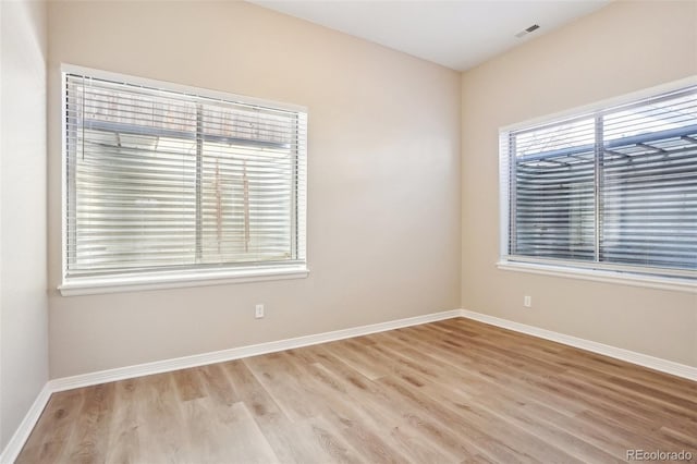 17309 Witten Ct, Parker, CO 80134 - empty room featuring light wood finished floors, baseboards, and visible vents