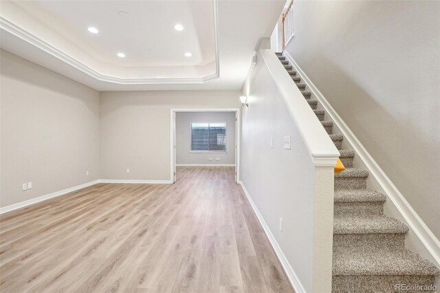 17309 Witten Ct, Parker, CO 80134 - stairway with recessed lighting, a raised ceiling, wood finished floors, and baseboards