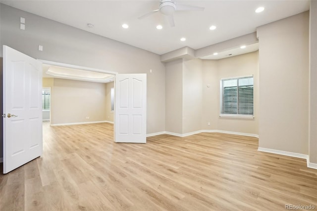 17309 Witten Ct, Parker, CO 80134 - unfurnished room featuring light wood-style flooring, ceiling fan, and a wealth of natural light
