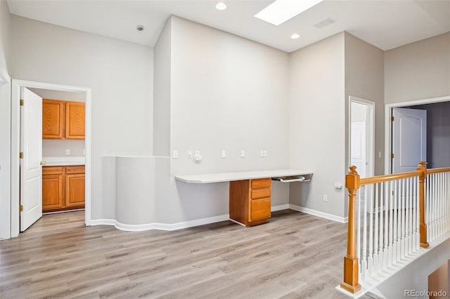 17309 Witten Ct, Parker, CO 80134 - interior space featuring light wood-type flooring, built in desk, and baseboards