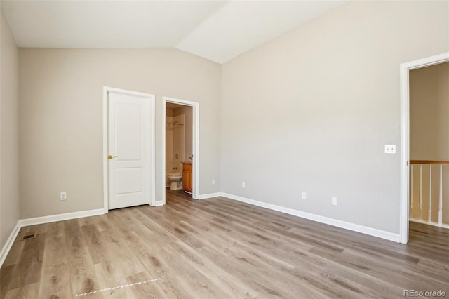 17309 Witten Ct, Parker, CO 80134 - interior space featuring baseboards, vaulted ceiling, and wood finished floors