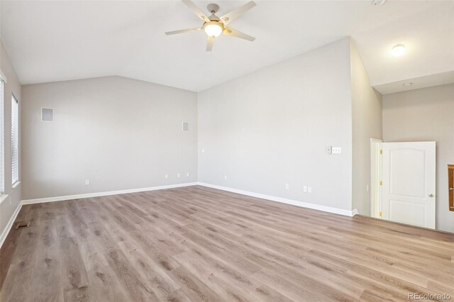 17309 Witten Ct, Parker, CO 80134 - spare room with ceiling fan, light wood-style floors, vaulted ceiling, and baseboards