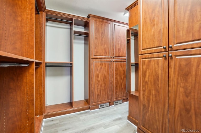 17309 Witten Ct, Parker, CO 80134 - walk in closet featuring light wood-style flooring and visible vents