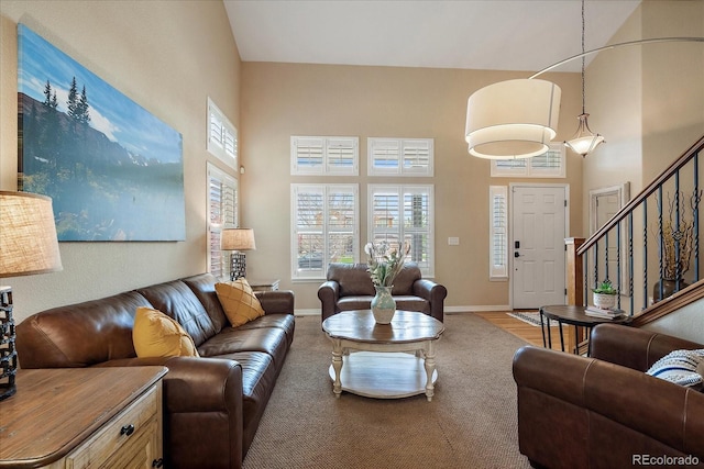 2861 Madison Ln, Broomfield, CO 80023 - living room with a high ceiling, baseboards, and stairway