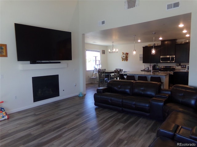 living room featuring dark wood-type flooring