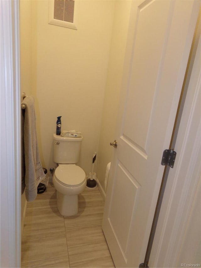 bathroom featuring toilet