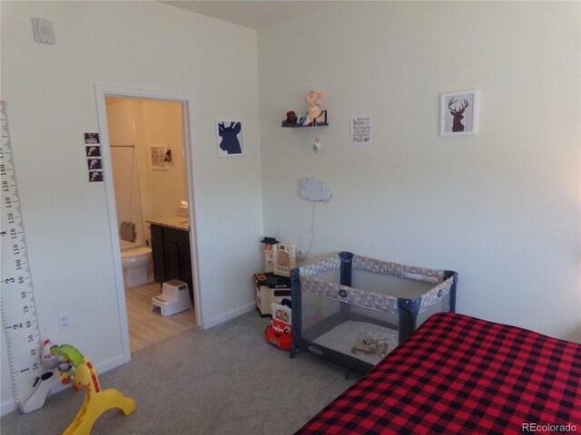 carpeted bedroom with ensuite bathroom