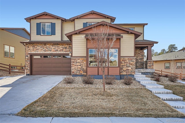 craftsman-style house featuring a garage, stone siding, and concrete driveway