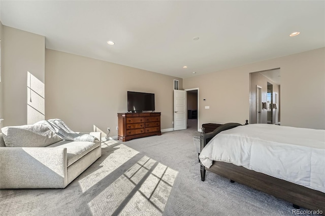 bedroom with recessed lighting, light carpet, and baseboards