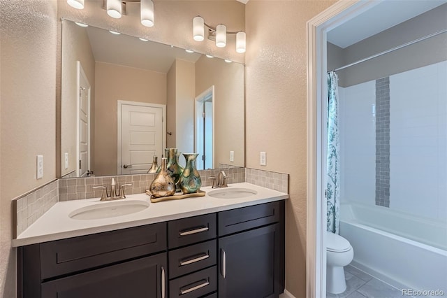 full bath with a sink, shower / bathtub combination with curtain, toilet, and double vanity