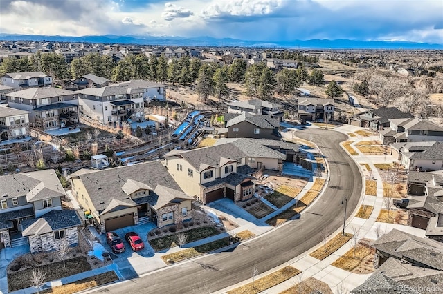 birds eye view of property with a residential view and a mountain view