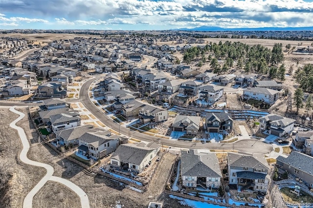 birds eye view of property with a residential view and a mountain view