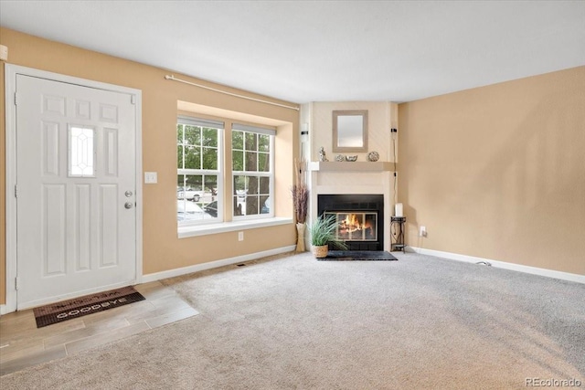 18131 E Arizona Ave Unit B, Aurora, CO 80017 - unfurnished living room featuring a glass covered fireplace and carpet