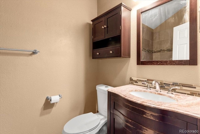 18131 E Arizona Ave Unit B, Aurora, CO 80017 - bathroom with vanity and a textured wall