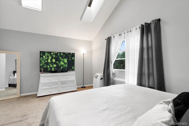 18131 E Arizona Ave Unit B, Aurora, CO 80017 - bedroom with vaulted ceiling, carpet floors, and a skylight