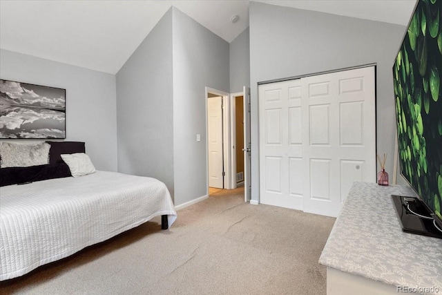 18131 E Arizona Ave Unit B, Aurora, CO 80017 - bedroom featuring vaulted ceiling, carpet floors, and a closet
