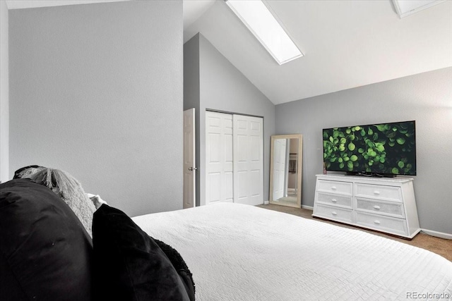 18131 E Arizona Ave Unit B, Aurora, CO 80017 - bedroom with light carpet, a skylight, a closet, and high vaulted ceiling