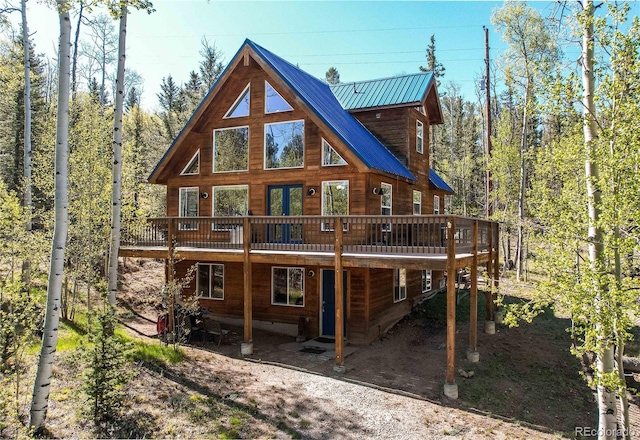 362 Kite Ct, Jefferson, CO 80456 - rear view of property featuring a wooden deck and a metal roof
