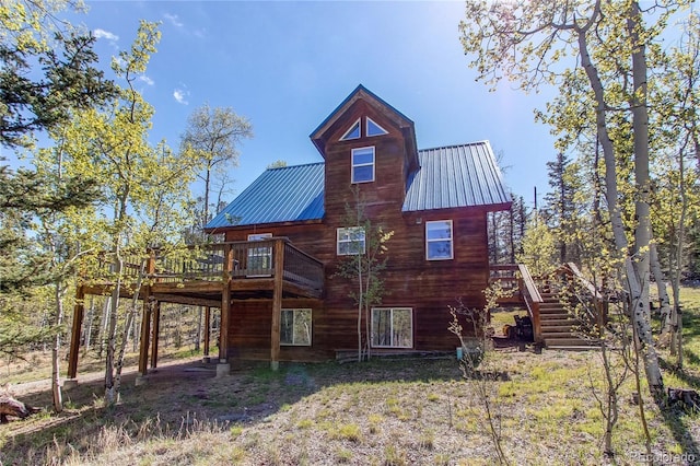 362 Kite Ct, Jefferson, CO 80456 - rear view of property with a wooden deck, stairway, and a metal roof
